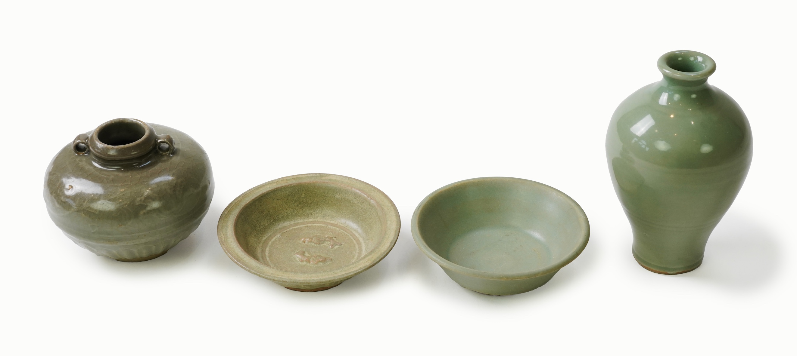 A group of four Chinese Celadon wares - two vases and two dishes, tallest vase 16cm.